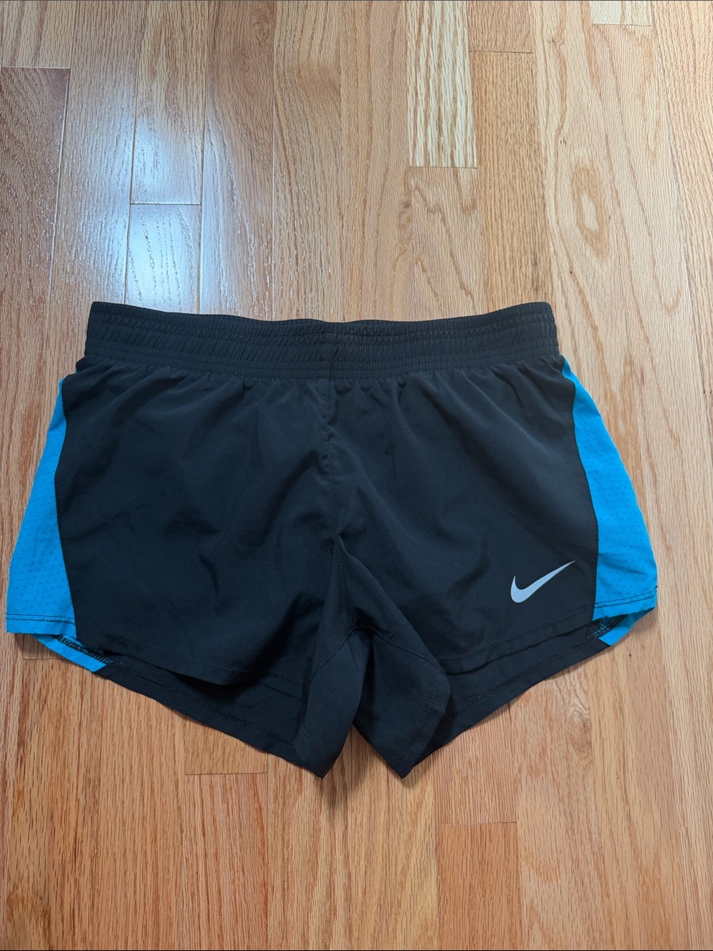 Nike Women's Black Shorts with Blue Side Panels